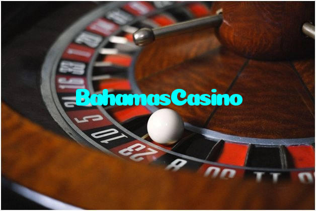 BahamasCasino casino presented on mobile device in Pakistan with slots and live games
